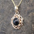 9ct gold frill and bead circular pendant with round hand cut Whitby Jet cabochon