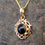 9ct gold frill and bead circular pendant with round hand cut Whitby Jet cabochon