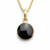 Circular 9ct gold and Whitby Jet pendant on gold curb chain