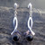 Long sterling silver crossover ribbon drop earrings with round Whitby Jet cabochons