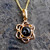 Hand crafted Whitby Jet 9ct gold open flower pendant necklace with round cabochon