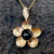 Hand crafted 9ct gold floral necklace with round Whitby Jet cabochon and leaf bail