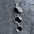 Contemporary long sterling silver pendant with three oval Whitby Jet stones