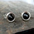 Modern round sterling silver stud earrings with Whitby Jet cabochons and a wide silver edge