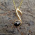 Hand crafted Whitby Jet 9ct gold music pendant with gold curb chain