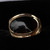 18 carat gold wide split ring with hand carved oval Whitby Jet stone