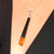 Unique hand carved long slim Jet and amber pendant