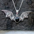 Large hand crafted silver bat necklace with black oval stone
