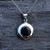 Hand crafted round locket with natural black gemstone with sterling silver frame