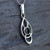 Celtic loop pendant with sterling silver and hand carved round organic black gemstone