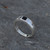 Contemporary sterling silver ring set with flush set square Whitby Jet stone