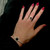 Sterling silver ring with twisted band and circular Whitby Jet stone