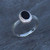 Ladies sterling silver rope edge ring with oval organic black gemstone