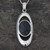 modern ladies Oval Whitby jet and sterling silver pendant