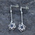Long slim modern sterling silver and Whitby Jet flower drop earrings with stud fastenings