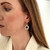 Contemporary black and silver flower dangly earrings