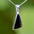 Contemporary asymmetrical sterling silver and Whitby Jet pendant with silver reverse
