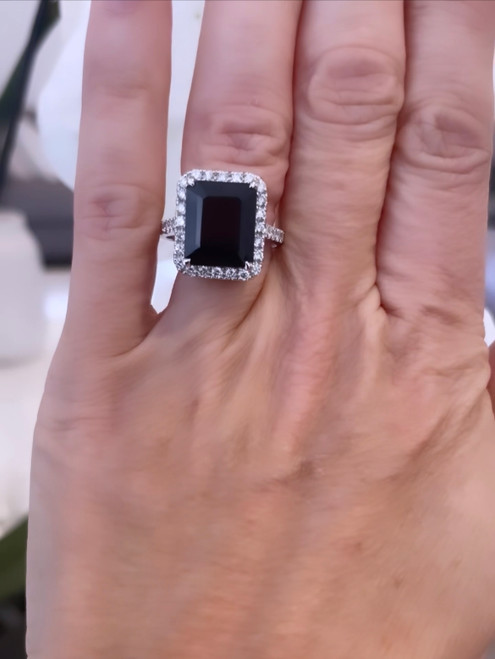 18ct White Gold Ring featuring a 5.85 carat Sapphire with diamond halo and diamonds half on the band 