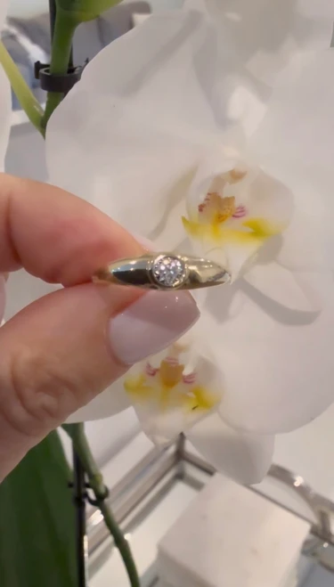 10k yellow gold ring featuring a natural diamond