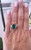 18ct White Gold Ring featuring a 3.88 carat Emerald with Trilliant cut Diamonds 