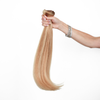Holding Golden Blonde Classic Clip In Hair Extension Cashmere Hair 