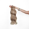 Holding Rodeo Drive Blonde Classic Clip In Hair Extensions Cashmere Hair 