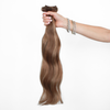 Holding Beverly Hills Brunette Classic Clip In Extensions Cashmere Hair