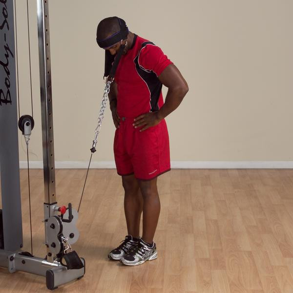 Body-Solid Neck Resistance Strap with Man Exercising on Cable Machine