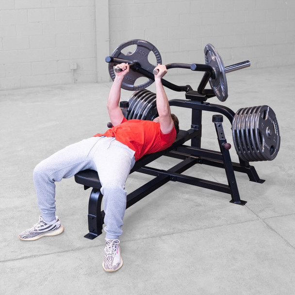 Body-Solid Converging Chest Station with Man Using Close Grip