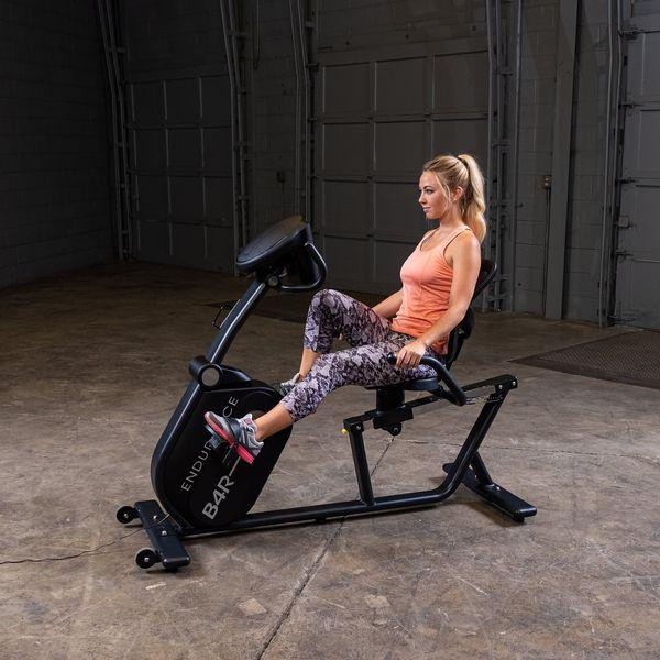 Body-Solid (B4RB) Recumbent Exercise Bike - Woman Exercising Side View