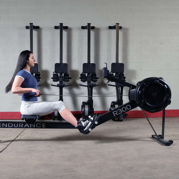 Woman Exercising on Body-Solid R300 Rowing Machine