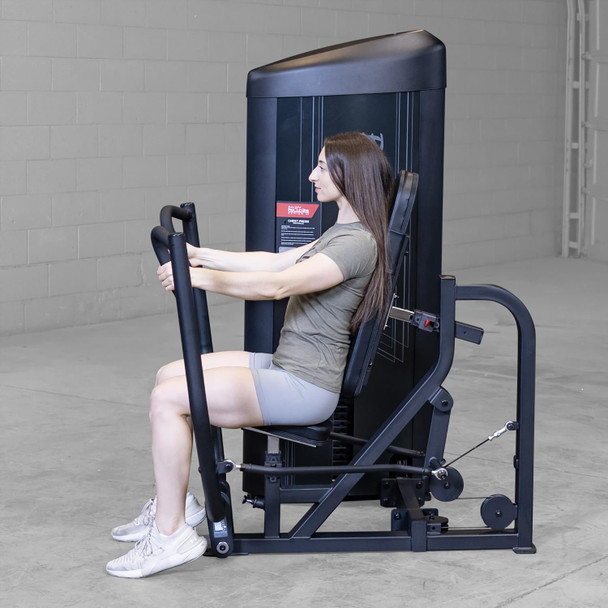 Body-Solid Seated Press Trainer During Woman's Chest Exercise