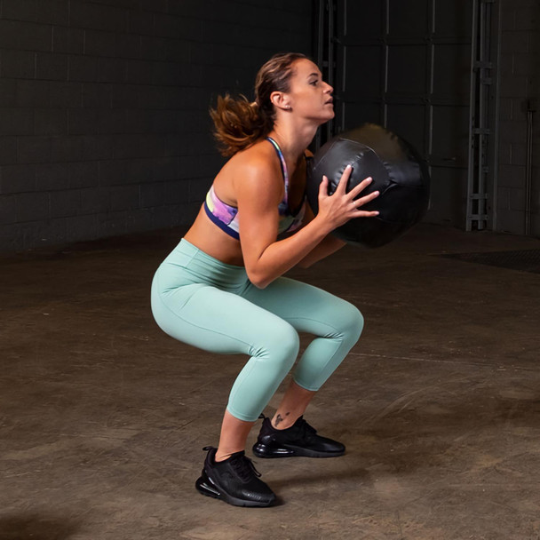 Woman Exercising with Dynamax Wall Ball