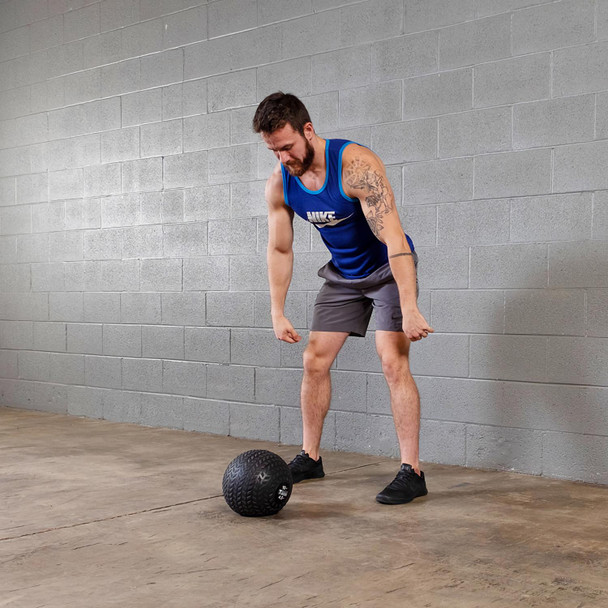Man Working Out with Body-Solid Slam Exercise Ball