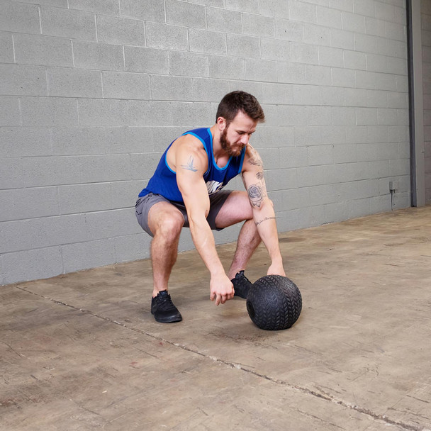 Man Exercising with Body-Solid Gym Slam Ball