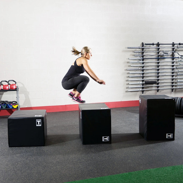 Three Body-Solid Soft Plyometric Boxes in Gym with Woman Exercising