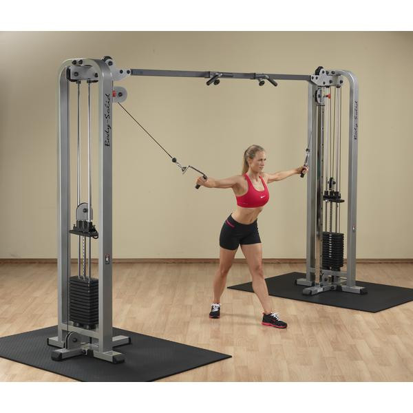 Body-Solid Dual Pulley Machine with Woman Performing Cable Cross