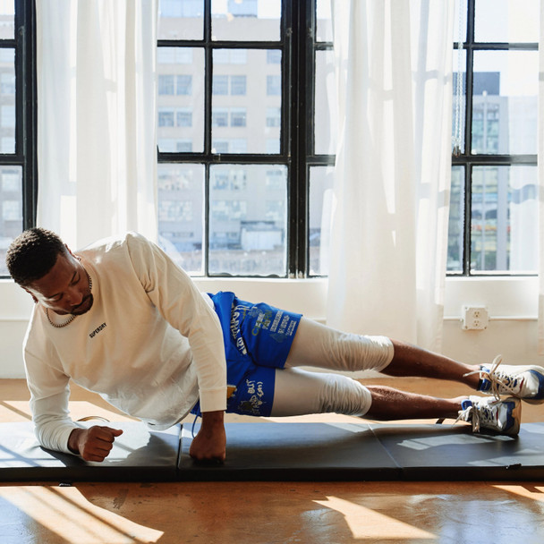 Aeromat Deluxe Folding Exercise Mat - Man Exercising on Mat in Fitness Studio