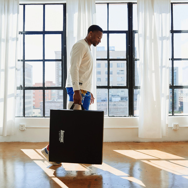 Aeromat Portable Training Pad Carried by Handles into Studio