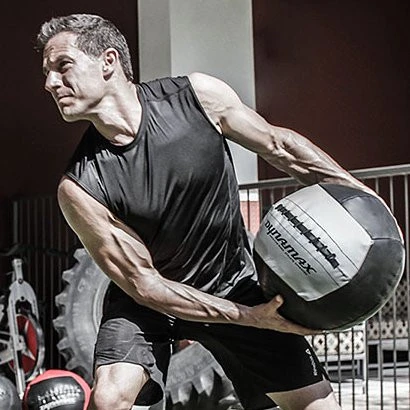 Dynamax 14" Soft Medicine Ball - Man Exercising in Training Facility