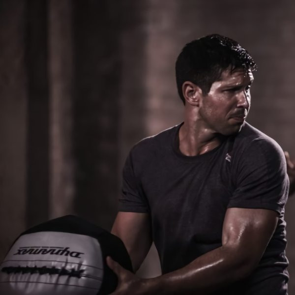 Dynamax Soft-Shell Medicine Ball - Man Training in Athletic Center