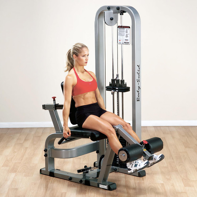 Body-Solid Quadriceps Extension Station with Woman Exercising