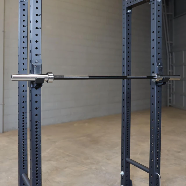 Body-Solid Compact Olympic Bar Pictured on Fitness Rack