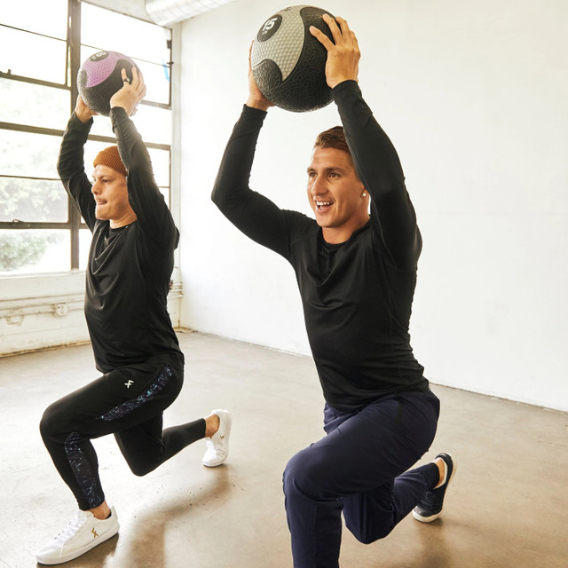 Aeromat Exercise Balls with Two People Exercising in Studio