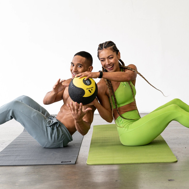 Aeromat Training Balls During Partner Trunk Twist Exercise