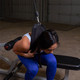 Body-Solid Abdominal Harness with Woman Exercising in Garage Gym