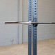 Body-Solid (OB86B) 7' Black Olympic Bar - Sleeve Close View Pictured on Power Rack