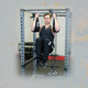 Body-Solid Hanging Ab Supports with Man on Power Cage Chin Bar