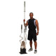 Body-Solid (GOBH5) Olympic Bar Holder w/ Optional Barbells Next to Fitness Model