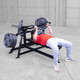 Body-Solid Independent Arm Press with Man Using Close Grip